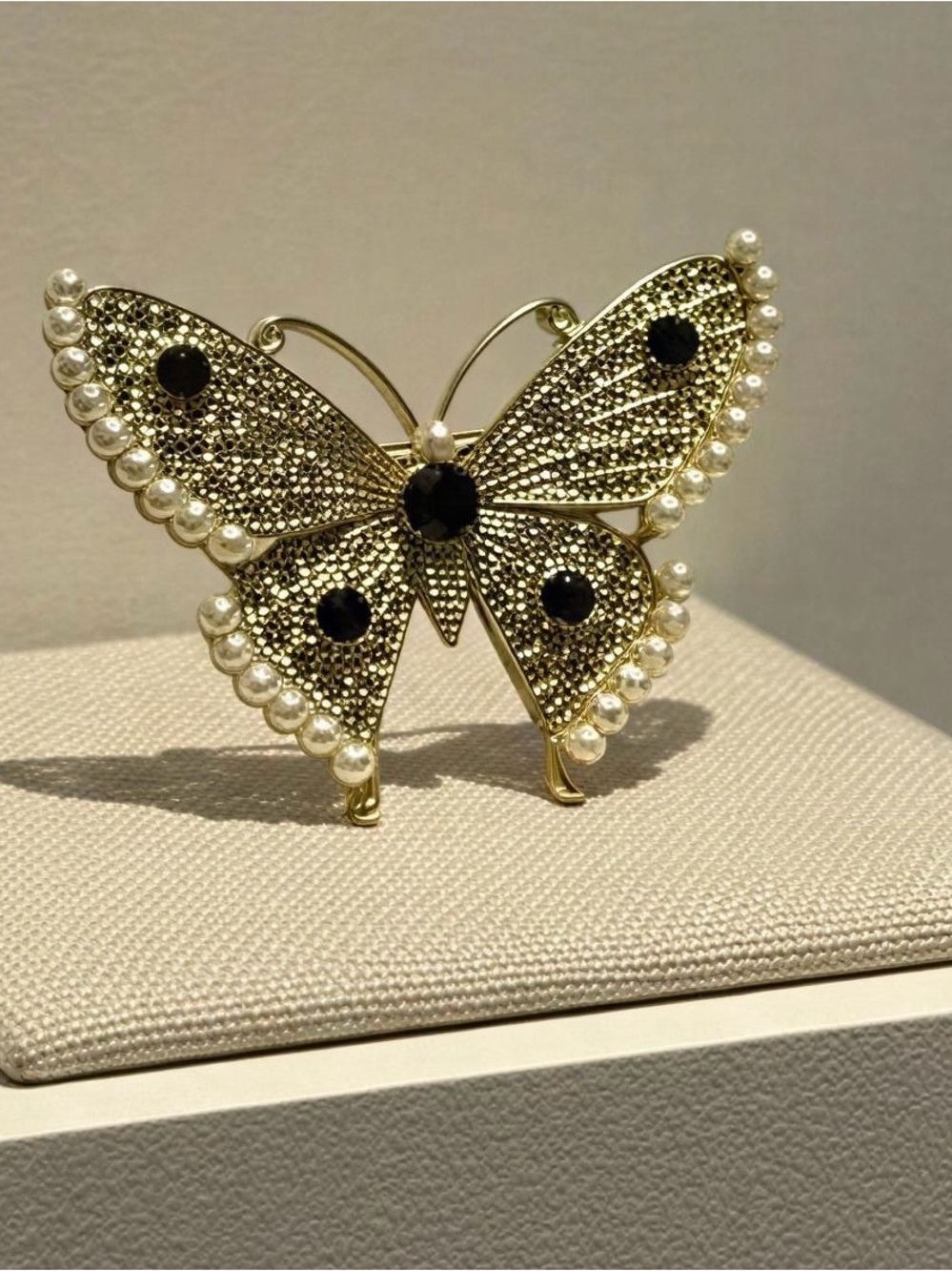 Gold Butterfly Brooch with Black Stones and Pearl Trim